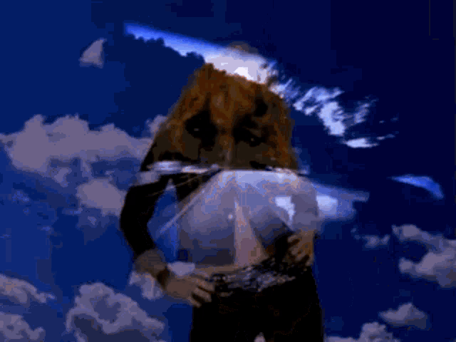 a woman in a denim jacket is standing in front of a blue sky with clouds