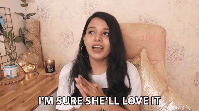 a woman is sitting in a chair and says i 'm sure she 'll love it