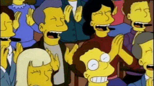 a group of cartoon characters are clapping and laughing in a theatre .