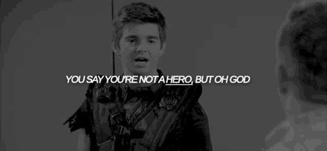 a black and white photo of a young man talking to another man with a quote .