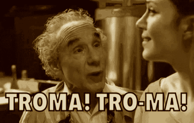 a man and a woman are talking and the woman says troma