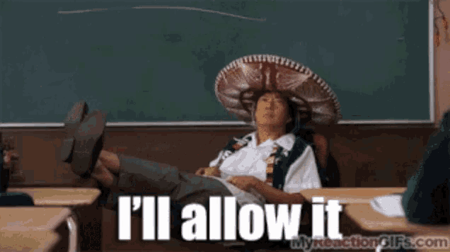 a man wearing a sombrero sits at a desk with his feet up and the words i 'll allow it above him
