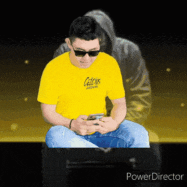 a man wearing sunglasses and a yellow shirt that says calcus