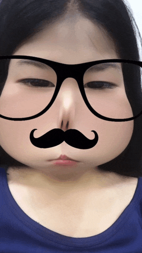a woman wearing glasses and a mustache on her face