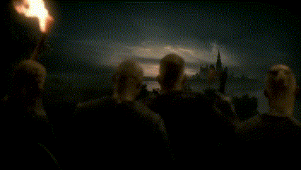 a group of people standing in a dark room with the words axe time on the bottom right
