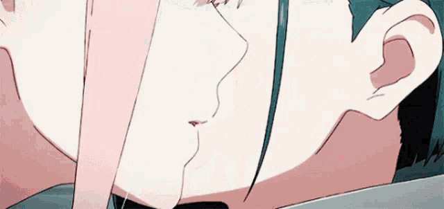 a man and a woman are kissing in a close up of a cartoon .