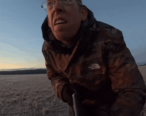 a man wearing a jacket that says the north face on it