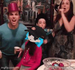 a group of people are gathered around a table with a picture of a girl with a hat on her head ..