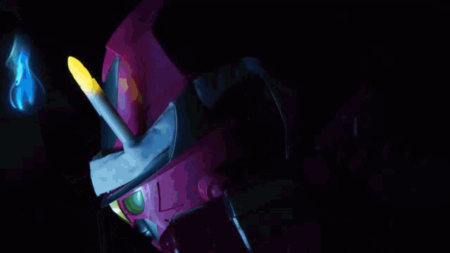 a pink robot with candles on it 's heads