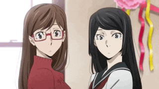 two anime girls are standing next to each other in a room and looking at each other .
