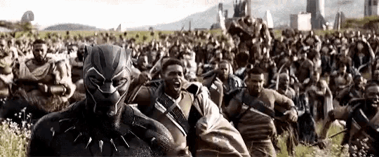 a black panther is surrounded by a large group of people .