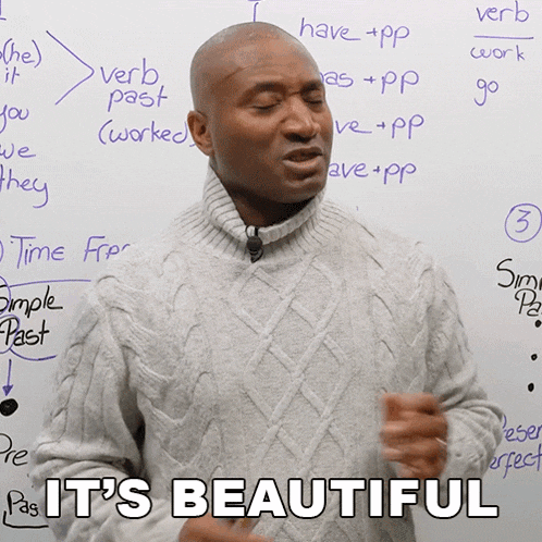 a man stands in front of a white board that says it 's beautiful