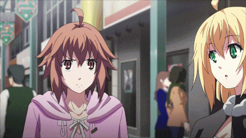 a girl in a pink hoodie with the letter t on it stands next to a blonde girl
