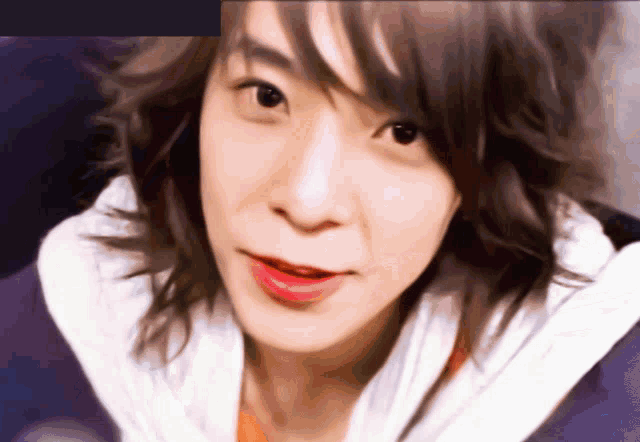 a close up of a person 's face with red lipstick