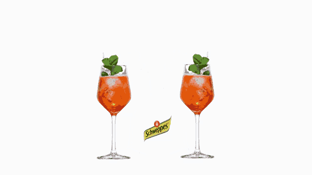 two glasses of schweppes drink with a heart in the background