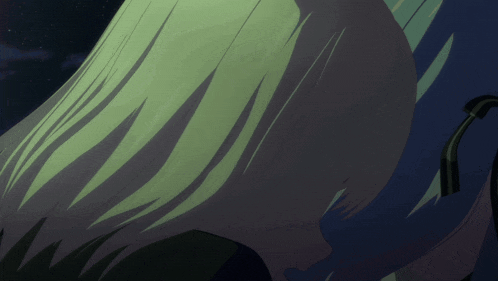 a close up of a person 's hair against a dark background