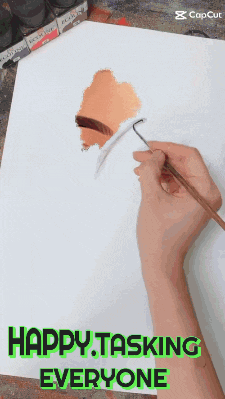 a person is painting on a piece of paper with the words happy tasking everyone below them