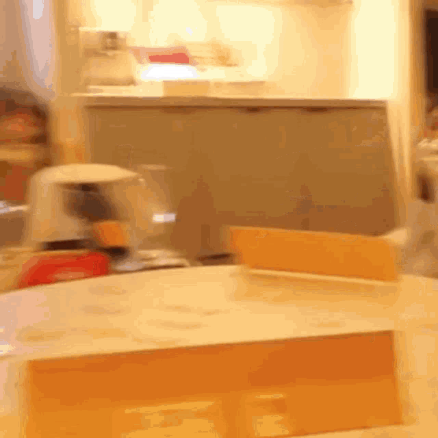 a blurred image of a table with a box on it that says ' a ' on it