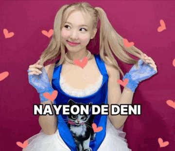 a woman in a blue and white dress with a cat on it is standing in front of a pink background surrounded by hearts .