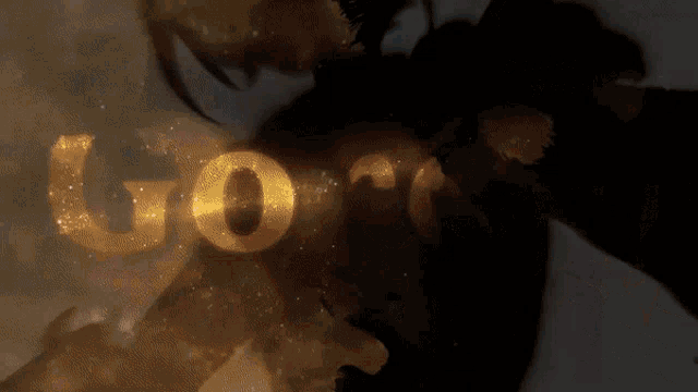 a dark background with the word goro written in gold letters