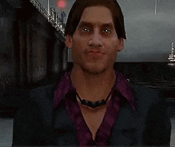 a man wearing a purple shirt and a black jacket is standing in front of a body of water .