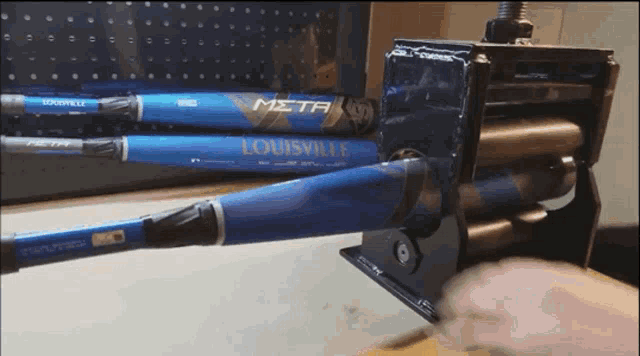 a louisville baseball bat is being rolled up