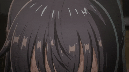 a close up of a anime girl 's face with a serious look on her face