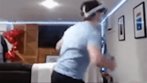 a blurry picture of a man wearing a virtual reality headset