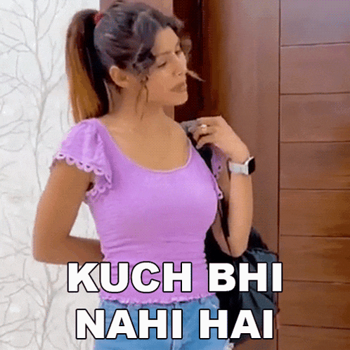 a woman in a purple top is standing in front of a door with the words kuch bhi nahi hai written on it