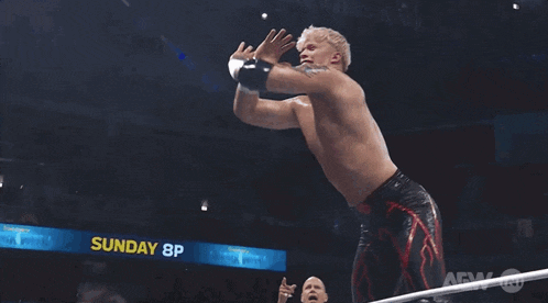 a wrestler in a ring with the word aew on the bottom right