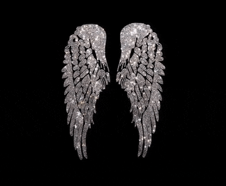 a pair of silver angel wings on a black background