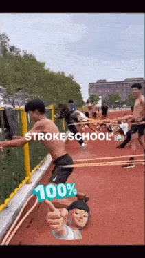 a group of people are doing exercises on a track and one of them is giving a thumbs up