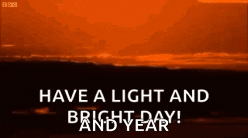 a picture of a sunset with the words `` have a light and bright day and year ''