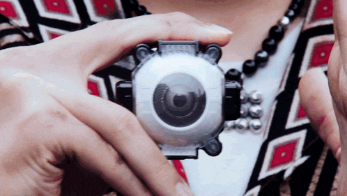 a close up of a person holding a camera that says ' ghost busters ' on it