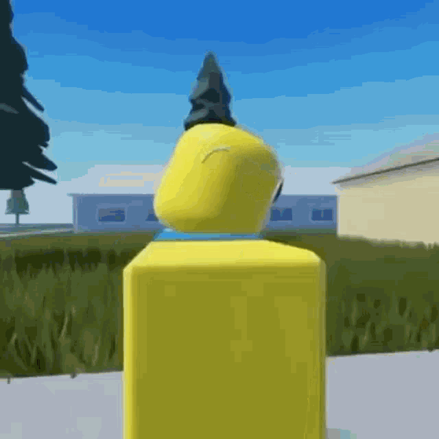 a yellow roblox character is standing on a sidewalk in a video game .