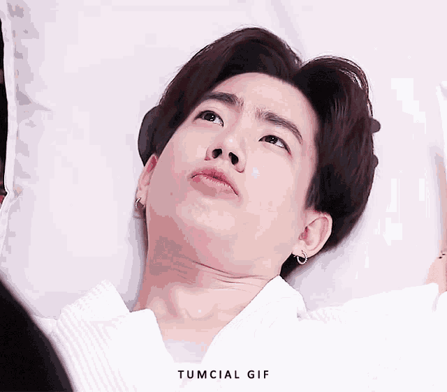 a close up of a person 's face with the words tumcial gif written below it