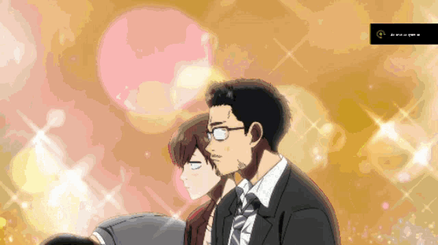a man in a suit and tie stands next to a woman in a pink dress