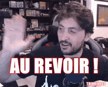 a man in a black shirt with the words au revoir on it