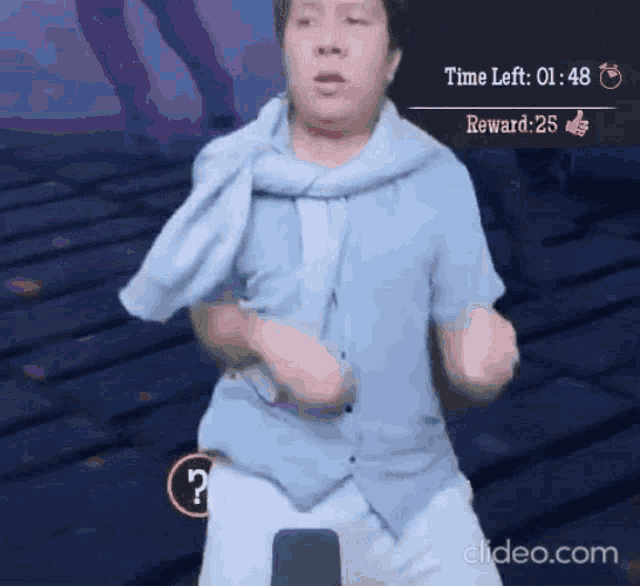 a man in a blue shirt is dancing in a video game with a time left of 01:48