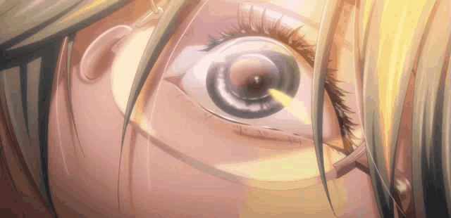 a close up of a woman 's eye with a yellow light coming out of it
