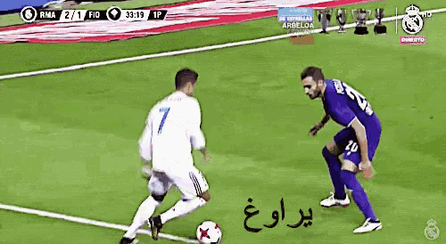 a soccer player with the number 7 on his jersey is about to kick the ball