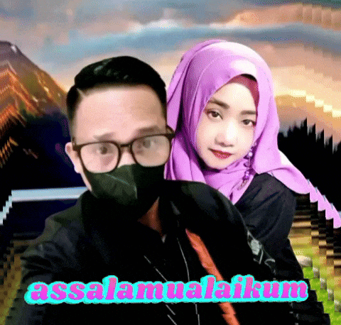 a man wearing glasses and a mask stands next to a woman wearing a purple head scarf