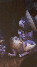 a cat wearing a purple hat is sitting on a white pumpkin