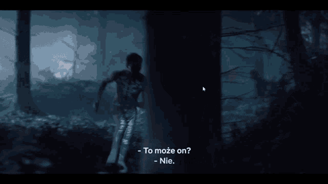 a man is running through a dark forest with a caption that says to może on nie