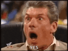 a man is sitting in a chair with his mouth open and says yes .