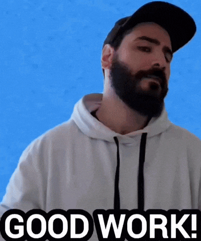a man with a beard is wearing a hat and a hoodie and says good work !