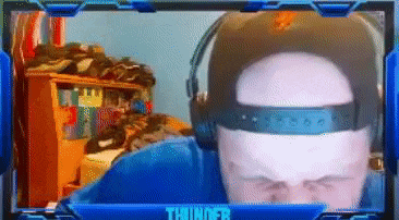 a man wearing headphones and a hat is on a screen with thunder written on it