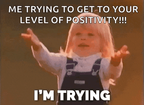 a woman is holding a basketball over her head and says i 'm trying to get to your level of positivity