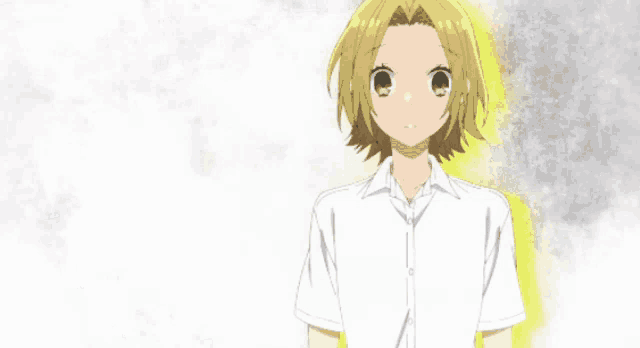 a girl with short blonde hair and a white shirt
