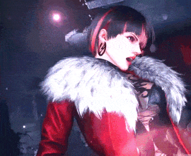 a woman in a red coat with a fur collar is standing in a dark room